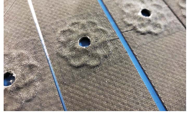 Figure 1: TFP hole reinforcements on prepreg laminates in the form of notch tensile specimens © ITA
